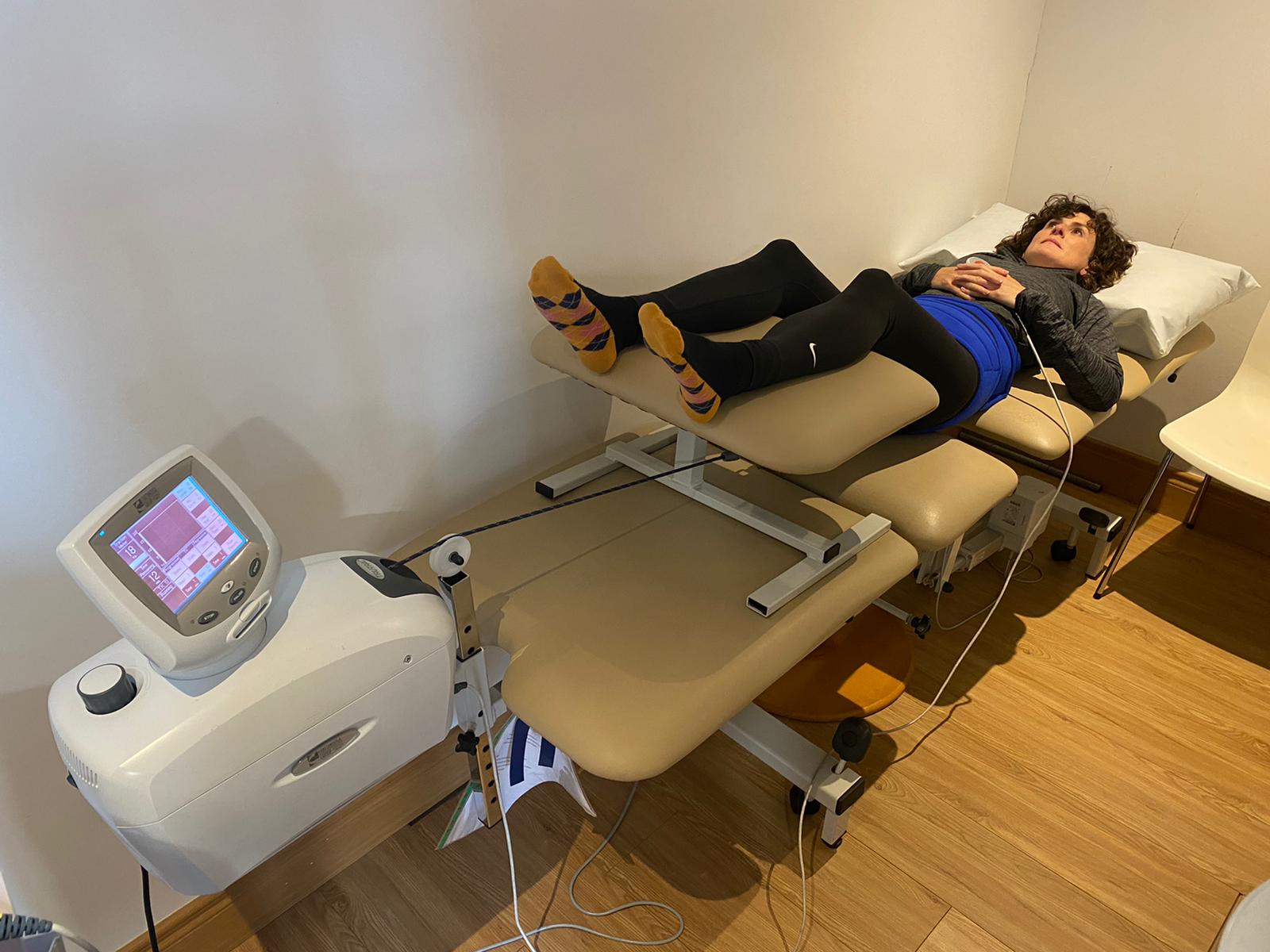 Patient lying on bench being seen by a Pure Physio Therapist